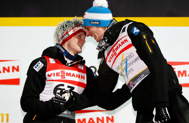 03.03.2011, Oslo, Norway (NOR): (l-r) Thomas Morgenstern (AUT), Fischer congratulates the winner Gregor Schlierenzauer (AUT), Fischer - FIS nordic world ski championships, ski jumping, individual HS134, Oslo (NOR). www.nordicfocus.com. © Laiho/NordicFoc