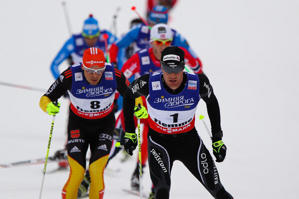 23.02.2013, Val di Fiemme, Italy (ITA): (l-r) Tobias Angerer (GER), Fischer, One Way, Rottefella, Adidas and Dario Cologna (SUI), Fischer, Swix, Alpina, Rottefella, Odlo - FIS nordic world ski championships, cross-country, skiathlon men, Val di Fiemme (I NordicFocus