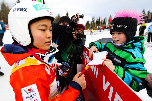 22.12.2013, Hinterzarten, Germany (GER): Sara Takanashi (JPN) writing autograms- FIS world cup ski jumping ladies, individual HS106, Hinterzarten (GER). www.nordicfocus.com. © Laiho/NordicFocus. Every downloaded picture is fee-liable. NordicFocus