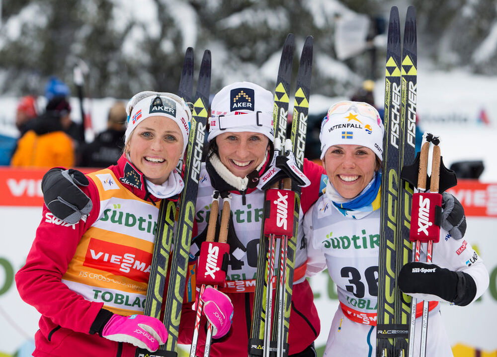 01.02.2014, Toblach, Italy (ITA): Therese Johaug (NOR), Marit Bjoergen (NOR), Charlotte Kalla (SWE)- FIS world cup cross-country, 10km women, Toblach (ITA). www.nordicfocus.com. © Manzoni/NordicFocus. Every downloaded picture is fee-liable.