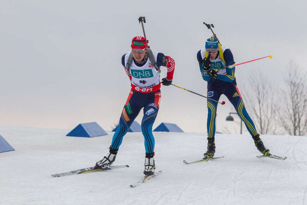 22.03.2014, Oslo, Norway (NOR): Alexander Loginov (RUS), Bjoern Ferry (SWE)- IBU world cup biathlon Holmenkollen, pursuit men, Oslo (NOR). www.nordicfocus.com. © Manzoni/NordicFocus. Every downloaded picture is fee-liable.