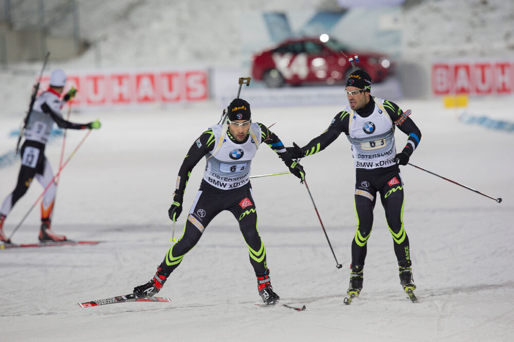 30.11.2014, Oestersund, Sweden (SWE): Martin Fourcade (FRA), Simon Fourcade (FRA) - IBU world cup biathlon, relay mixed, Oestersund (SWE). www.nordicfocus.com. © Manzoni/NordicFocus. Every downloaded picture is fee-liable.