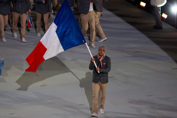 07.02.2014, Sochi, Russia (RUS): Jason Lamy Chappuis (FRA) carrying the flag- XXII. Olympic Winter Games Sochi 2014, opening ceremony, Sochi (RUS). www.nordicfocus.com. © NordicFocus. Every downloaded picture is fee-liable. NordicFocus