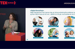 Lucie Aunan i Helsedirektoratet mener en KI-basert digital førstelinje må bygge på kvalitetssikret helseinformasjon og gi innbyggerne trygge råd før de eventuelt kontakter fastlege eller legevakt.. Foto: Klipp fra video av samtalen Bildet viser Lucie Aunan på scenen, og en av ppt-ene som sier noe om hva en digital førstelinje er.